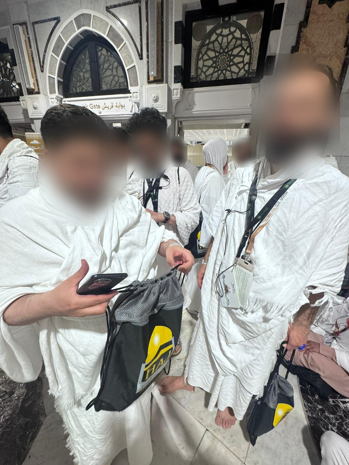 Pilgrims in ihram at the Haram gate